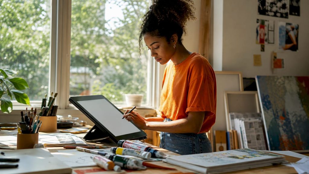 Woman drawing on tablet digital whiteboard
