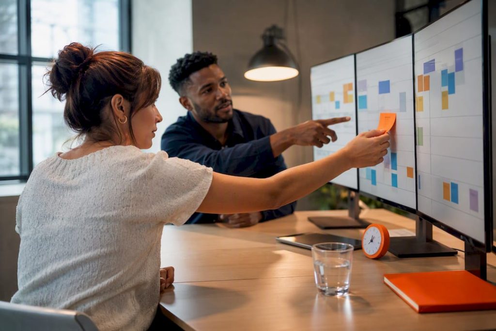 Remote Scrum team planning a sprint board