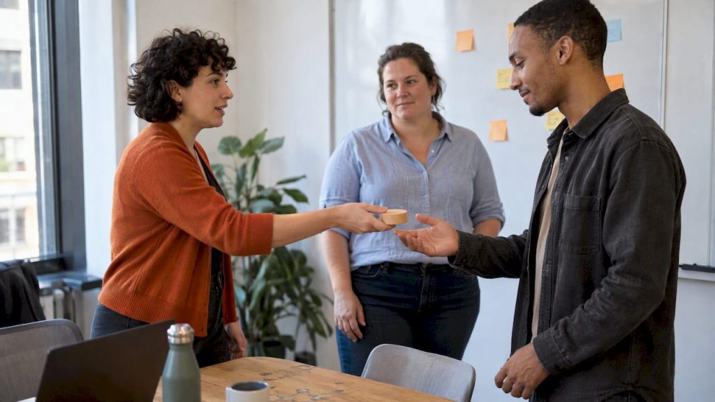 Team passing a speaking token during standup